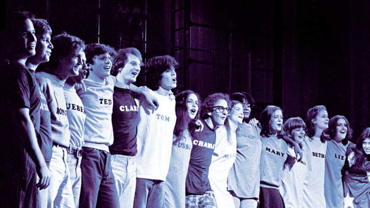 a group of people standing together on stage